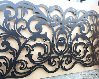 May include: A large, matte black metal panel featuring an intricate, laser-cut scrollwork pattern with symmetrical floral-inspired curves and a central oval element. The text "Design Studio Art Caprice" is visible in the center of the panel.
