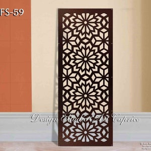 May include: A brown metal room divider with a geometric pattern of stars and flowers. The divider is called "OFS-59" and is from "Design Studio Art Caprice".