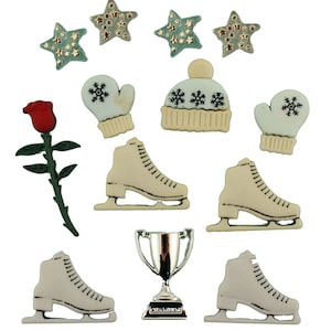 May include: A collection of decorative embellishments featuring ice skates, a trophy, stars, a rose, a hat, and mittens. The ice skates are off-white with black laces. The stars are teal with gold accents. The trophy is silver.