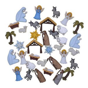 May include: A collection of Christmas-themed decorative buttons. The buttons feature various religious figures, including angels, Mary, Joseph, and baby Jesus in a manger. Other buttons include stars, sheep, donkeys, and palm trees.