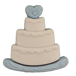 May include: A white three-tiered wedding cake with a blue heart on top. The cake is on a blue base with a wavy design.