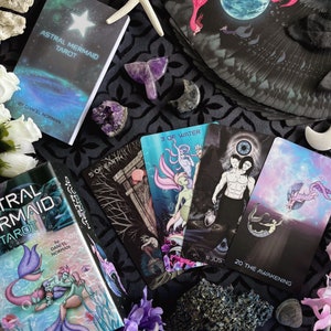 Astral Mermaid Tarot comes with a two piece box, 104 page guidebook and 80 cards