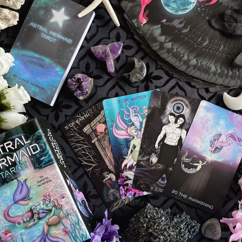 Astral Mermaid Tarot comes with a two piece box, 104 page guidebook and 80 cards