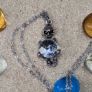Necklace of a Skeleton Holding a Sphere of Jade...or Quartz, Obsidian, Blue Sandstone, Goldstone Clear Quartz