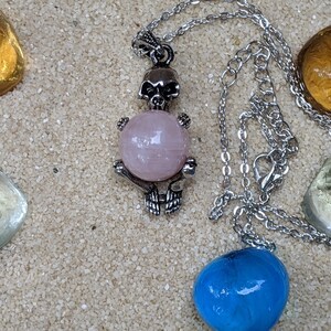 Necklace of a Skeleton Holding a Sphere of Jade...or Quartz, Obsidian, Blue Sandstone, Goldstone Rose quartz