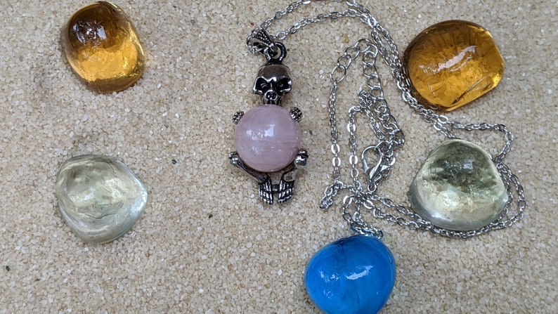 Necklace of a Skeleton Holding a Sphere of Jade...or Quartz, Obsidian, Blue Sandstone, Goldstone Rose quartz