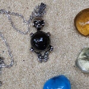 Necklace of a Skeleton Holding a Sphere of Jade...or Quartz, Obsidian, Blue Sandstone, Goldstone Obsidian