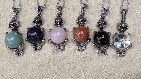 Necklace of a Skeleton Holding a Sphere of Jade...or Quartz, Obsidian, Blue Sandstone, Goldstone