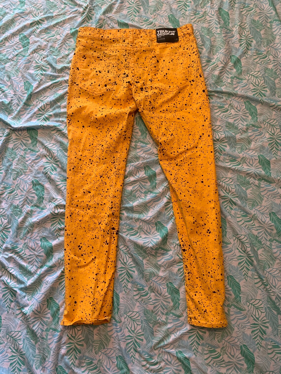 black jeans with yellow stripe