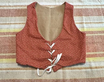 Top bustier con cordones y estampado floral de cobre