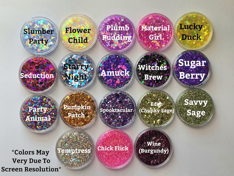 May include: A collection of seventeen circular containers filled with various coloured craft glitters. Each container features a label with names including Slumber Party, Flower Child, Plumb Pudding, Material Girl, Lucky Duck, Seduction, Starry Night, Amuck, Witches Brew, Sugar Berry, Party Animal, Pumpkin Patch, Spooktacular, Eden, Savvy Sage, Temptress, Chick Flick, and Wine.