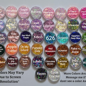 May include: A collection of forty-two circular containers filled with various coloured glitter, each labelled with names such as Spun Sugar, Princess Piggy, Sugar Cookie, Aurora, Strawberry n Creme, Bunny, Cherry Turnover, Hot Pink Hustle, Blue Taffy, Olaf, Gumdrop, Iced Orchard, Eggplant, Peach Out, Gravender, Hot Mess, Sea Storm, Pink Mascato, Sea Witch Purple, Kevin, 626, Oceanic, Sapphire Deep Blue, Lucky Charm, Hunter Christmas Green, Apple Fritter, Oh My Gourd, Pumpkin Guts, Red Obsession, Autumn, Rake n Bake, Royal, Fall Spice, Falling for you Burgundy, Chunky Rose Gold, Lullaby, Chocolate Brown, Lanister Gold, Disco Ball, Wooder, Raven, and Code Cracker.