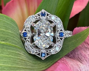 Ladies 14k Natural Sapphire and Forever One Center Moissanite Ring.