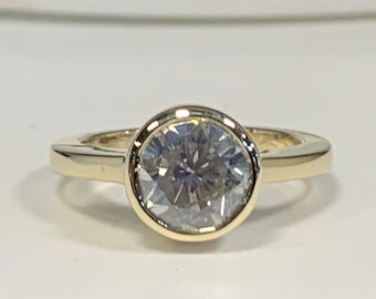 Ladies 14kt solitaire Round Brilliant  shape Forever One  Moissanite Ring.