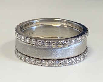 Ladies 14kt white gold moissanite forever one wide wedding band .
