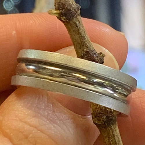 Flat Brush finish Wedding Band with Grooved Center finished in High Polish. 8 shops MM