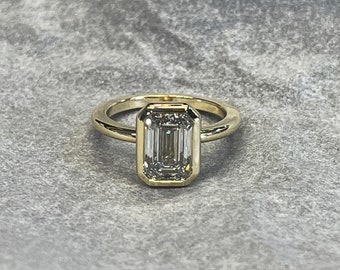 Ladies 14kt solitaire 2 Carat Emerald Cut  shape Forever One  Moissanite Ring.