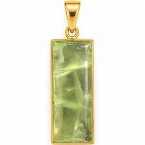 May include: A rectangular pendant featuring a translucent, light green gemstone set in a polished gold-tone metal frame. The stone displays natural internal inclusions and a smooth, flat surface, suspended from a matching gold-tone bail.