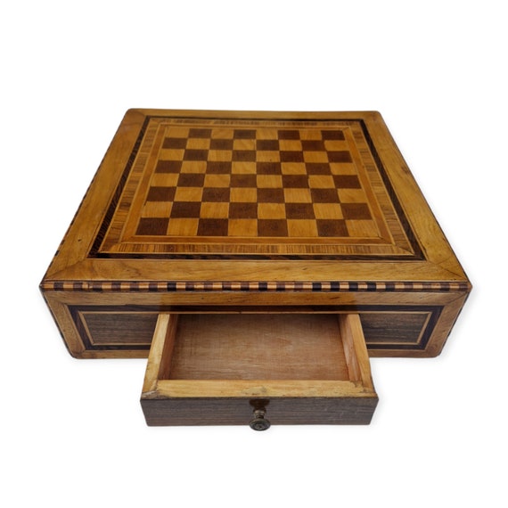 Handmade checkers in walnut, cypress, rosewood, and olive wood.