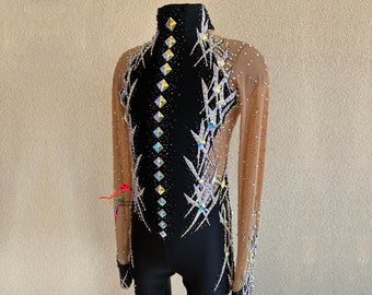 May include: Black leotard with a long-sleeved mesh overlay. The leotard features a geometric design with silver and iridescent rhinestones.
