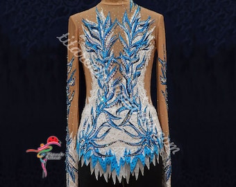 May include: A long-sleeved leotard with a nude base and a white and blue floral design. The design features blue and white rhinestones and a blue and white trim.