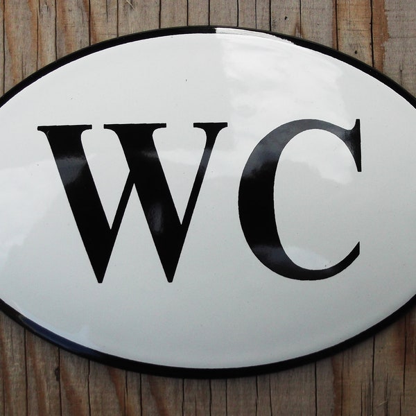 Classic Enamel WC Bathroom sign. Black text on a white background. 12x8cm. Oval