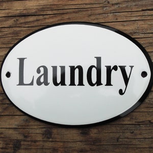 Classic Enamel Laundry sign. Black text on a white background, 12x8cm.
