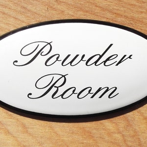 Classic Enamel Powder Room sign, 10x5cm. Black text on a white background