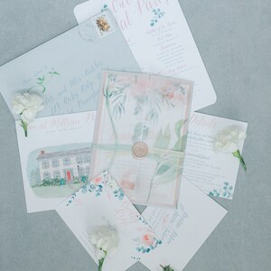 May include: Wedding invitation suite with a watercolor floral design. The invitations are on white cardstock with pink and blue accents. The text on the invitations reads "Our Party" and "Details".