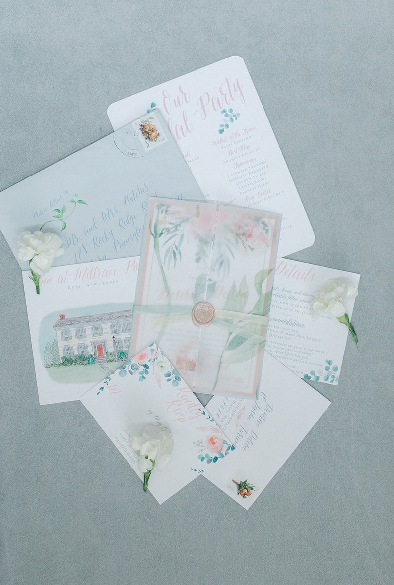 May include: Wedding invitation suite with a watercolor floral design. The invitations are on white cardstock with pink and blue accents. The text on the invitations reads "Our Party" and "Details".