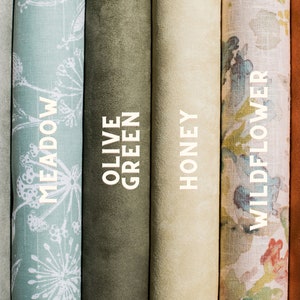 May include: Close-up of six fabric swatches in different colors and patterns. The swatches are labeled "Sage", "Meadow", "Olive Green", "Honey", "Wildflower", and "Terracotta".