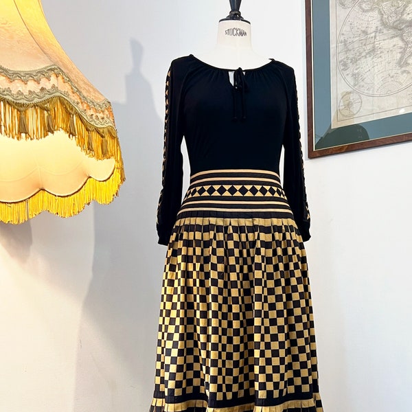 Genuine 1970s bohemian dress. Long black and ochre checkered fit and flare maxi dress