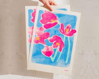 May include: A watercolor print of pink flowers on a blue background. The print is signed "Flowers 21" in the bottom right corner.