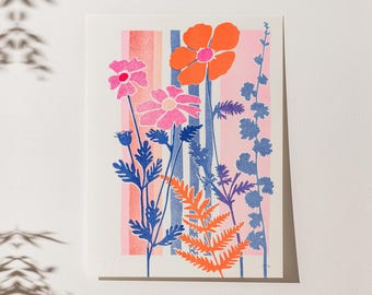 May include: A floral art print featuring stylized flowers in shades of pink, orange, and blue. The design includes a large orange flower, pink flowers, and various leaves and stems against a backdrop of vertical pink and blue stripes.
