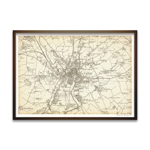 May include: A vintage map of York, England, printed in black and white. The map shows the city's streets, parks, and landmarks. The title "York" is printed in large letters at the centre of the map.