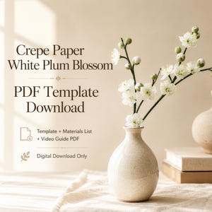 May include: A digital download for a Crepe Paper White Plum Blossom PDF template. The image features a speckled beige ceramic vase holding white plum blossom branches, with text reading Crepe Paper White Plum Blossom PDF Template Download.