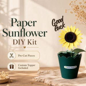 May include: A paper sunflower DIY kit with pre-cut pieces and a custom topper. The sunflower has yellow petals and a dark brown center, displayed in a dark green pot. The words "Good Luck" are on a separate topper. The kit includes the text "Paper Sunflower DIY Kit".