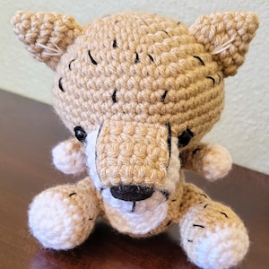 Animal de peluche de guepardo de ganchillo