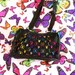 Kristina Arntz reviewed PLAYBOY Handbag Vintage Y2K Black Holographic Rainbow Purse 90s Retro Babygirl Bunny Iconic Designer Glitter Glam Bratz Cute 2000s Pattern