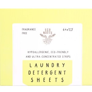 Puede incluir: Una caja amarilla con texto blanco que dice "FRAGRANCE FREE", "ECO ROOTS", "64x", "HYPOALLERGENIC, ECO-FRIENDLY AND ULTRA-CONCENTRATED STRIPS", "LAUNDRY DETERGENT SHEETS". La caja contiene hojas de detergente para la ropa.