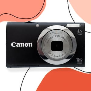 Appareil photo vintage canon noir comme neuf avec boite