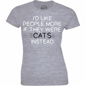 May include: Gray t-shirt with the text "I'd like people more if they were cats instead" printed in white.