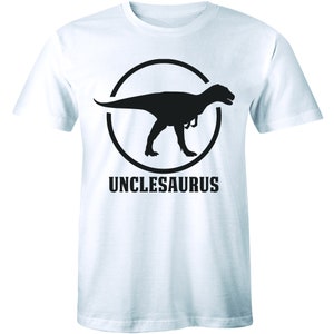 May include: White t-shirt with a black silhouette of a dinosaur inside a circle and the text "Unclesaurus" below.
