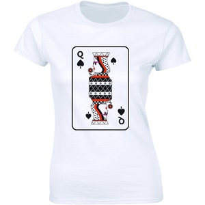 May include: A white t-shirt with a black and white illustration of the Queen of Spades playing card. The Queen is depicted in a stylized design with red and black accents.