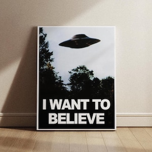 May include: A black and white poster with a photo of a flying saucer and the text "I WANT TO BELIEVE".