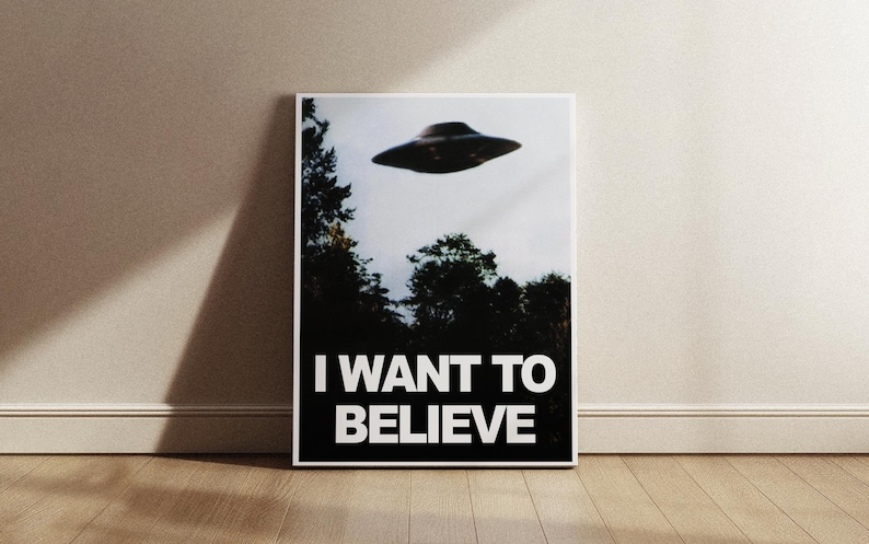 May include: A black and white poster with a photo of a flying saucer and the text "I WANT TO BELIEVE".