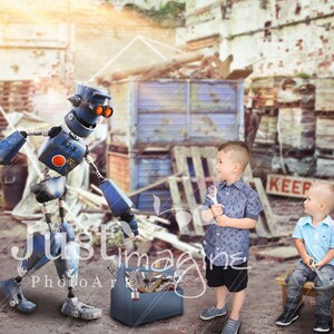 May include: A blue robot with a red circle on its chest stands in front of two children. The children are holding tools and standing in front of a toolbox. The background is a junkyard with a sign that says "Keep Out".