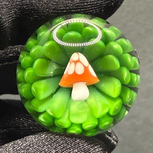 1.08 Inch Handmade Glass Marble Mushroom and Green Implosion Pattern - Includes Wooden Display Stand - Heady Glass Art Marble for Collectors