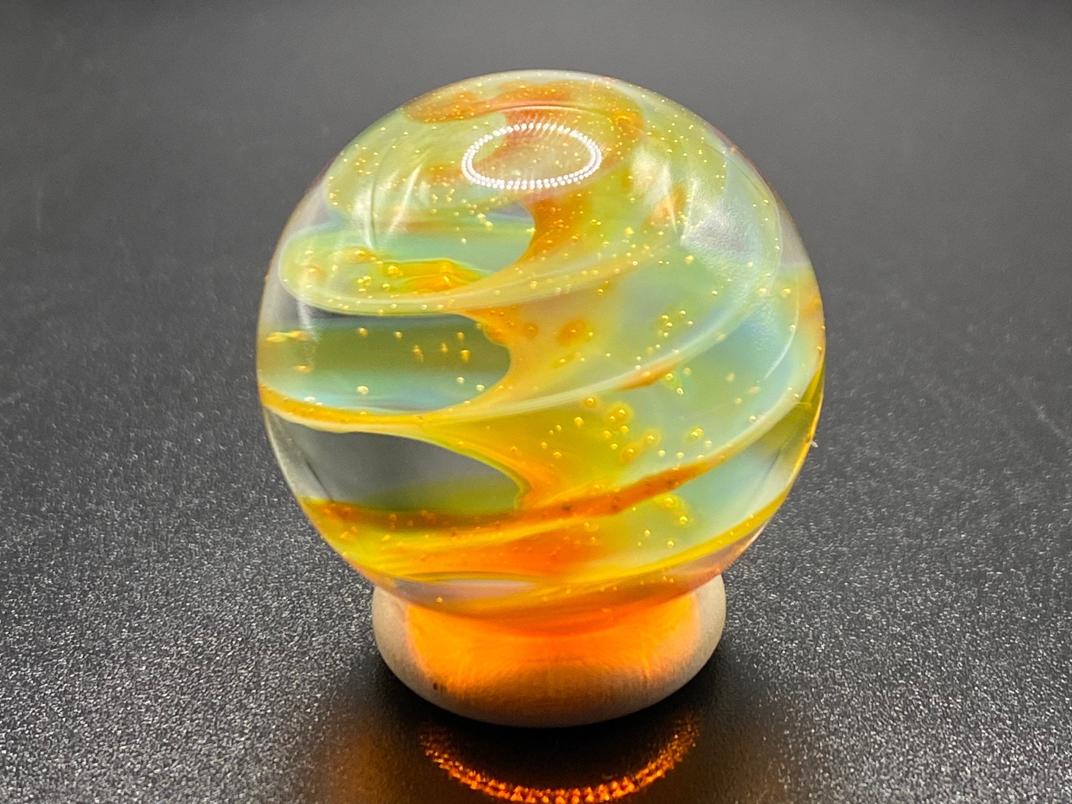 Round we go by Sarah Lust on   Glass marbles, Red glass, Black and  gold marble