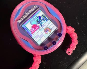 Packung mit 2 handgefertigten Tamagotchi-Uni-Hüllen